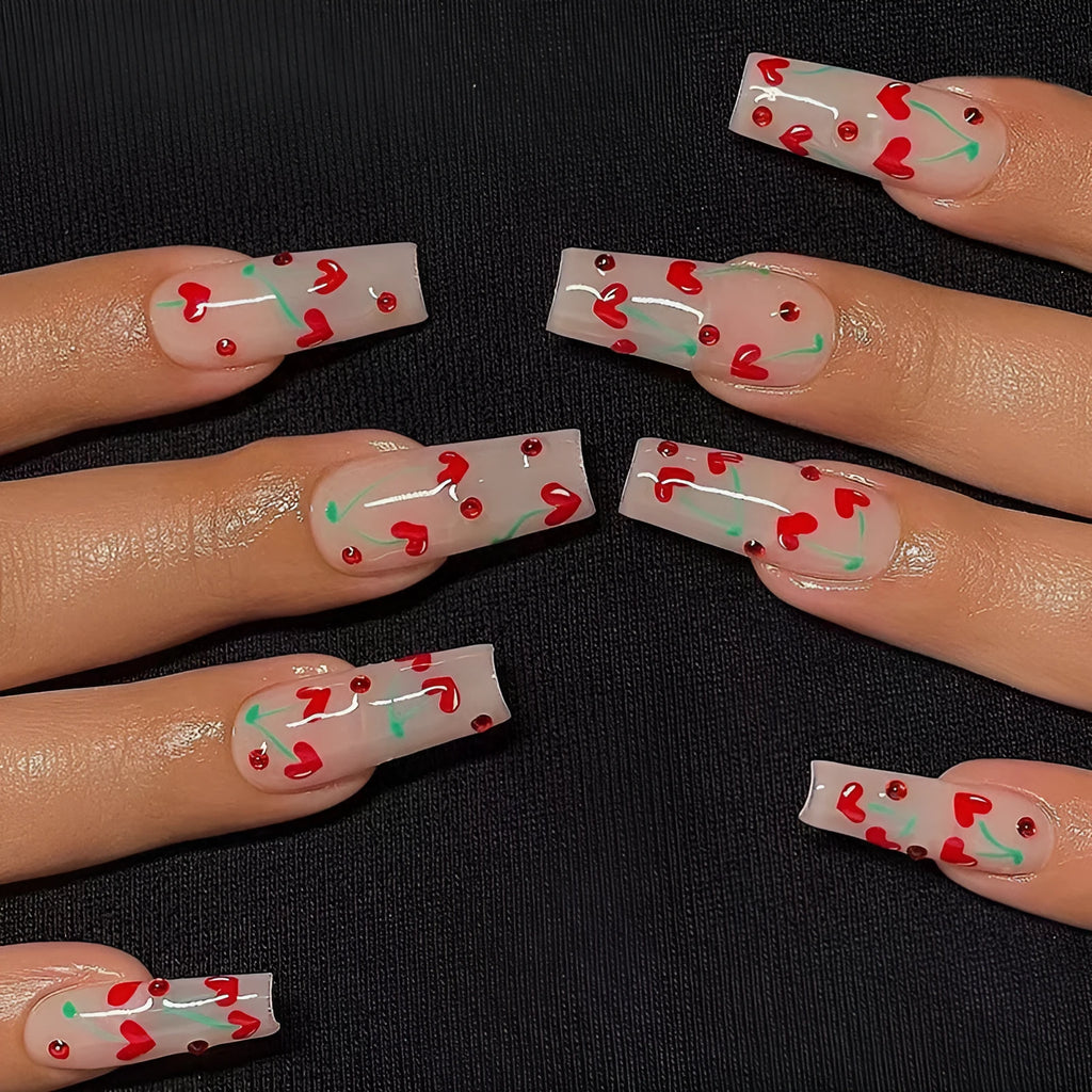 Set of 24 red cherry and diamond shaped nail art decorations for French manicure designs.