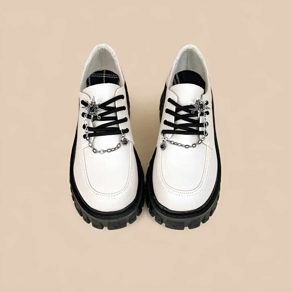 Women's Duke Asterism colour loafers with a metal cross shoulder strap and round toe.