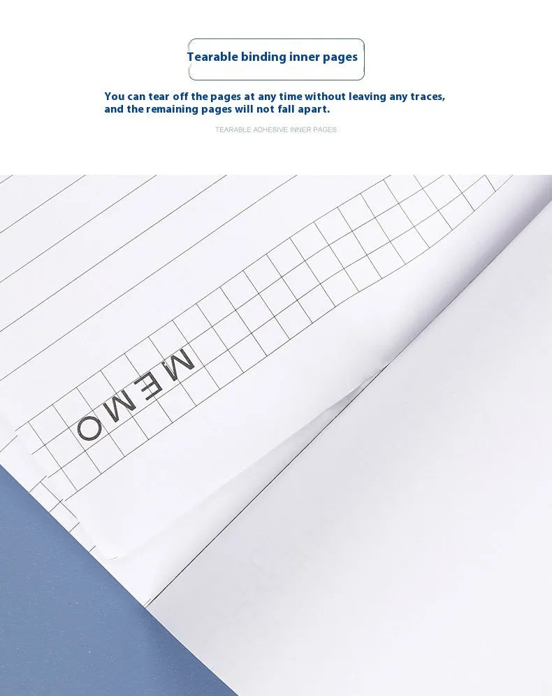 A4 wire-o bound tear-off notepad open on a table, showing ivory white grid pages.