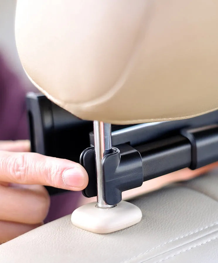 Black universal car phone holder mounted on vehicle rear seat base holding tablet