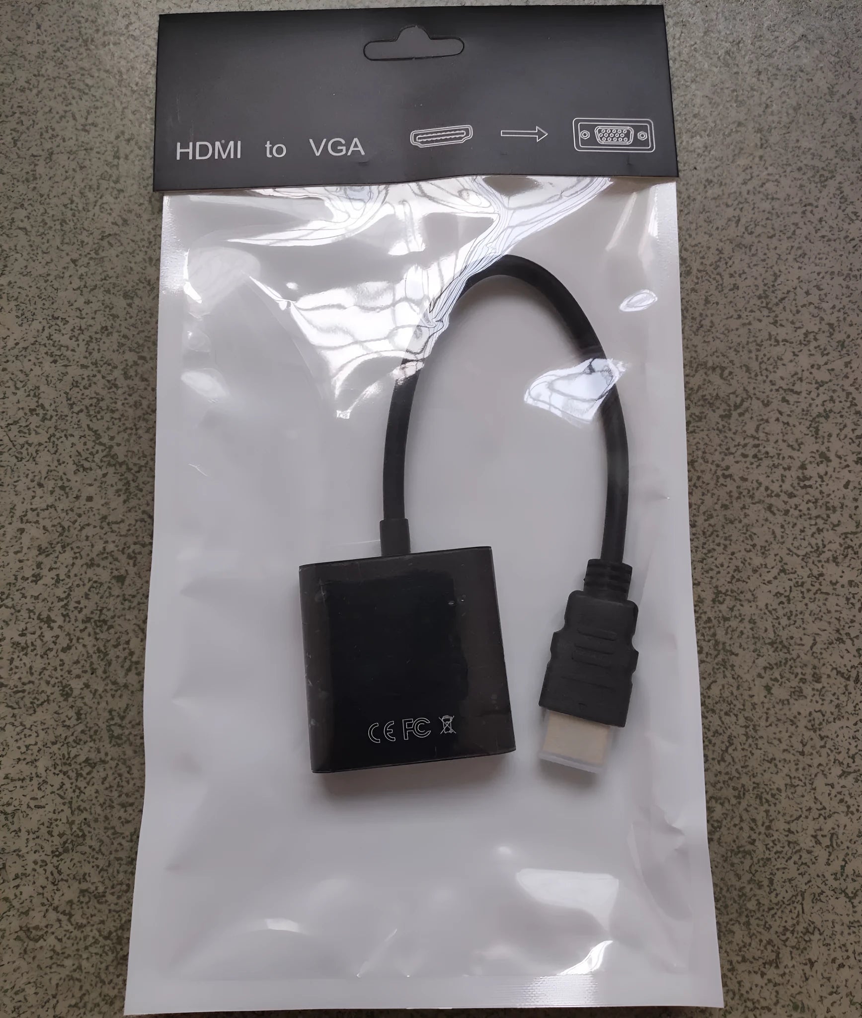 HDMI to VGA converter adapter with 0.3 metre black cable connecting to set-top box
