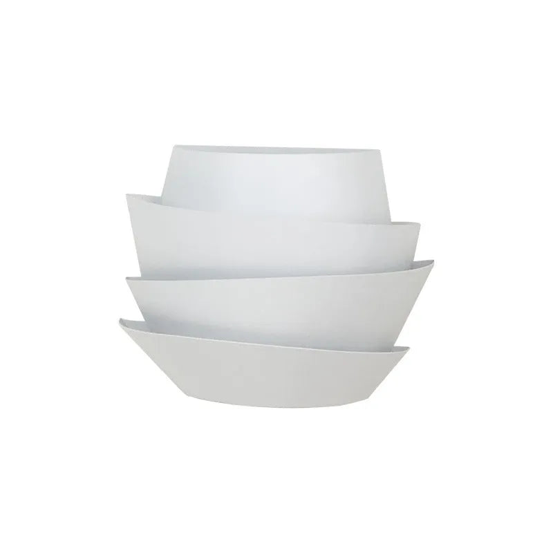 White modern wall lamp with pine cone silhouette design for bedroom or hallway lighting