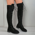 Black lace-up over-the-knee boots with a round toe and flat sole on a neutral background.