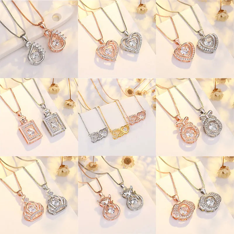 Silver heart pendant necklace with crown above and bow below on delicate chain