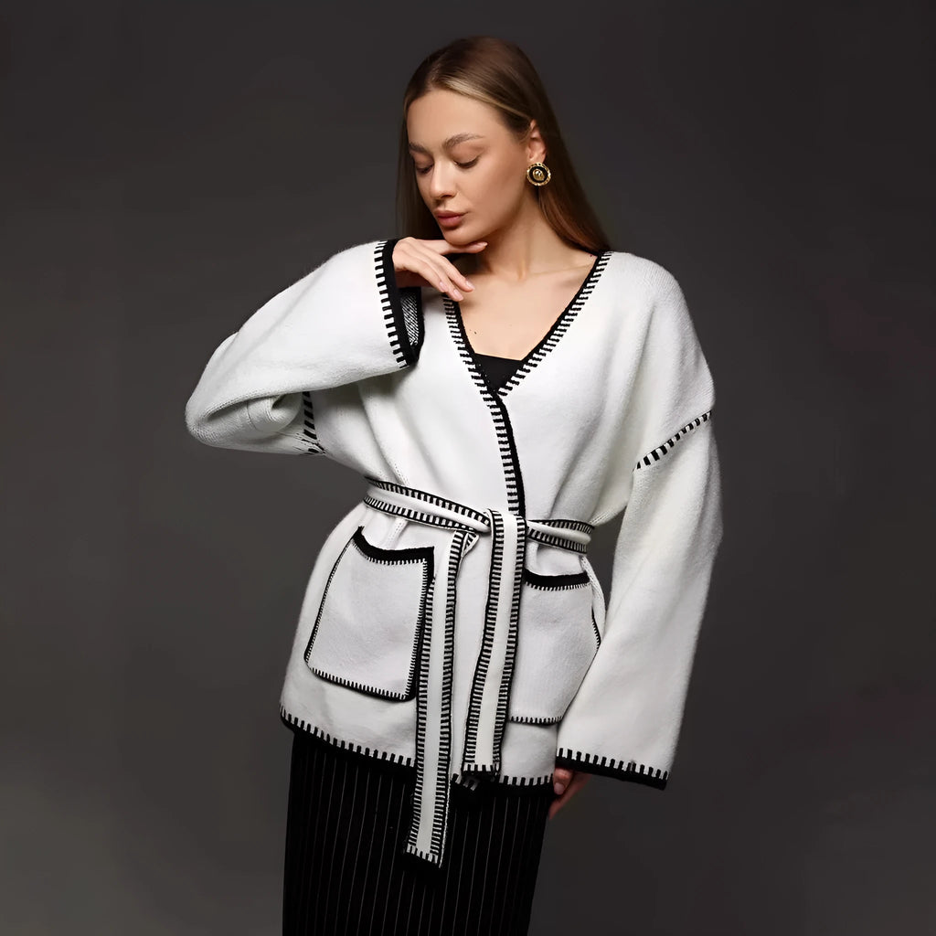 Lace-up front knitted cardigan in black, camel, or white, showing loose fit and thick fabric.