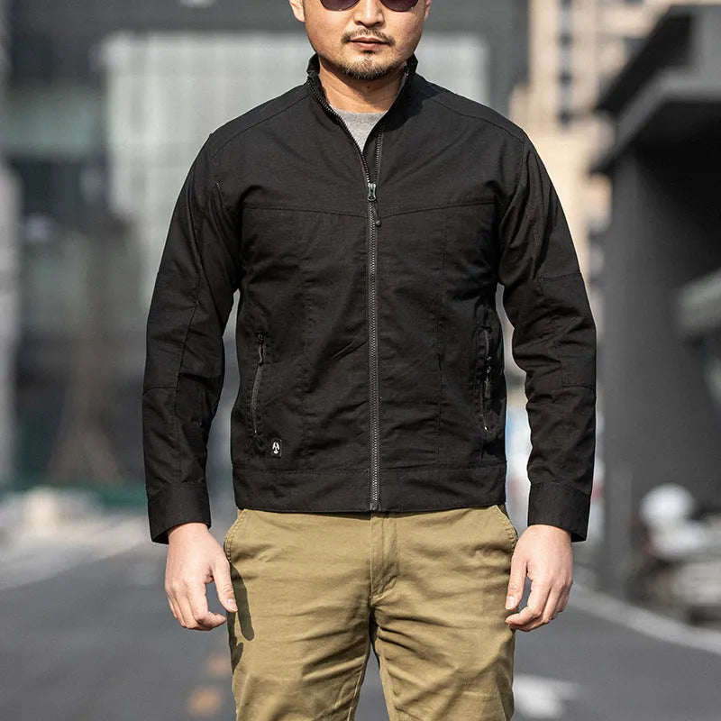Men's brown plaid tactical camouflage jacket with multiple pockets on a man outdoors.