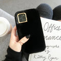 Rabbit plush phone case with thick padding and soft silicone shell for iPhone, shown in apricot colour.