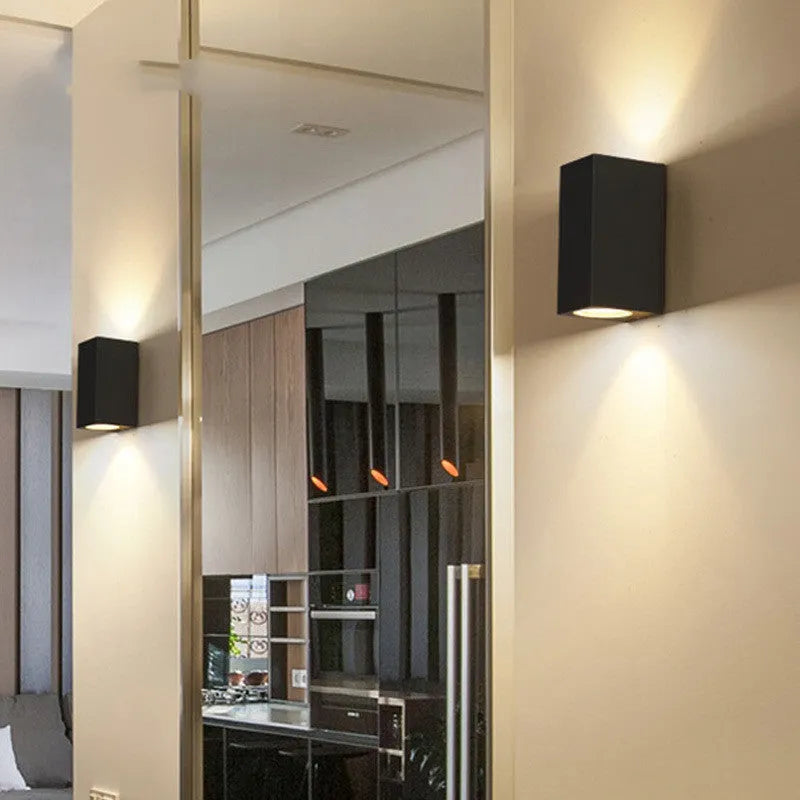 Black aluminium and glass wall-mounted LED lamp with choice of 10W or 12W power.
