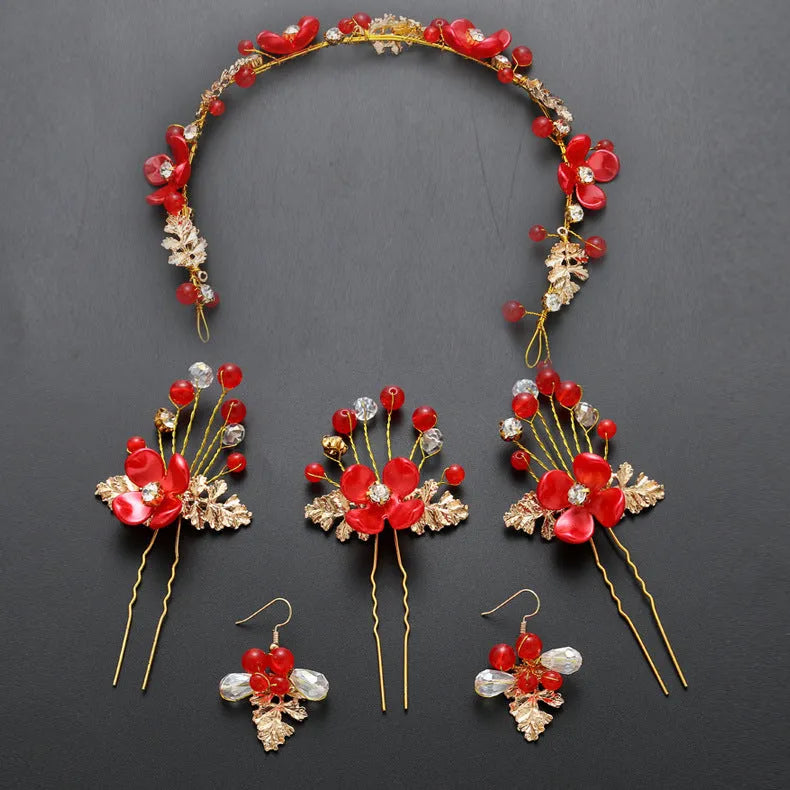 Costume jewellery set with bride headdress and hair ornaments featuring rhinestone and pearl details on gold metal