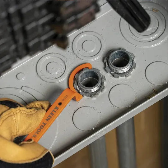 Three colour-coded magnetic suction catheter locking wrenches: orange, grey, and black, arranged as a tool set.