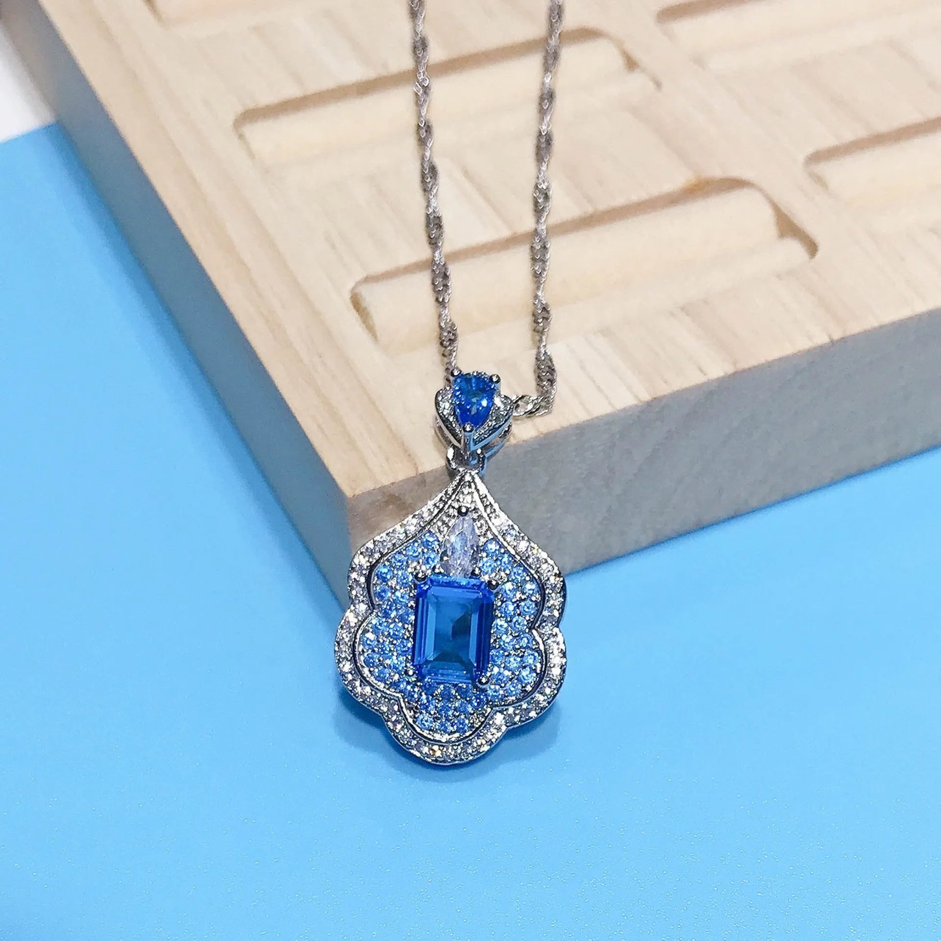 Sea blue geometric copper pendant with aquamarine topaz sky mirror appearance