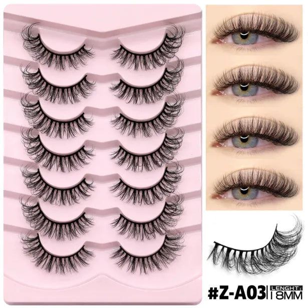 Box of natural false eyelashes with thick artificial fibre lashes and included glue tube