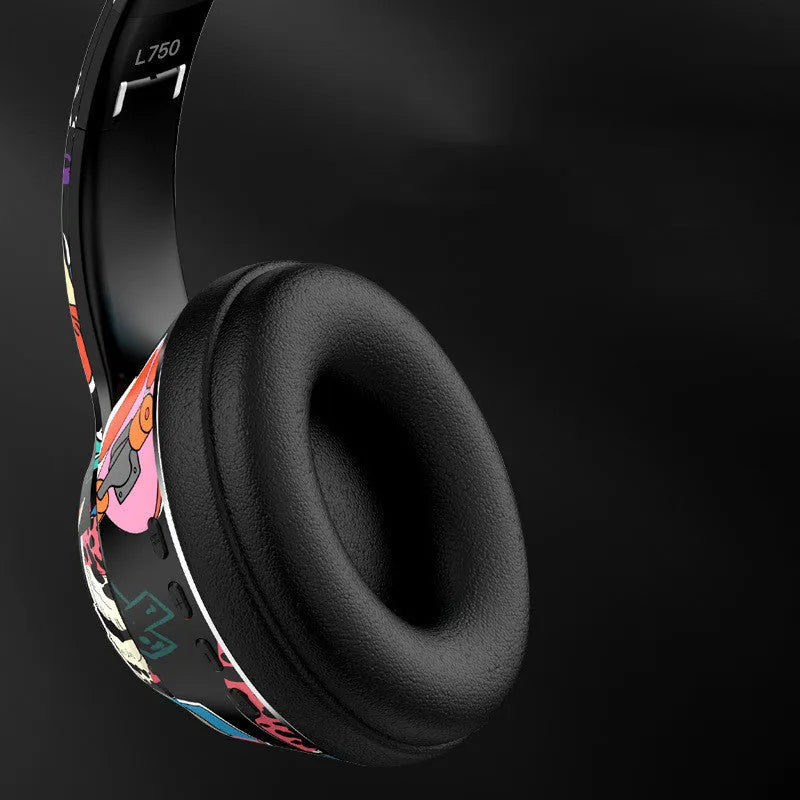 Graffiti wireless Bluetooth headset in black or white, showing head-mounted design.