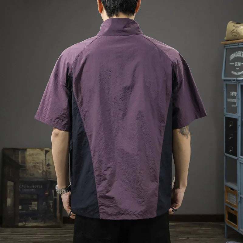 Brown men's half-zip stand collar casual shirt with short sleeves on a hanger.