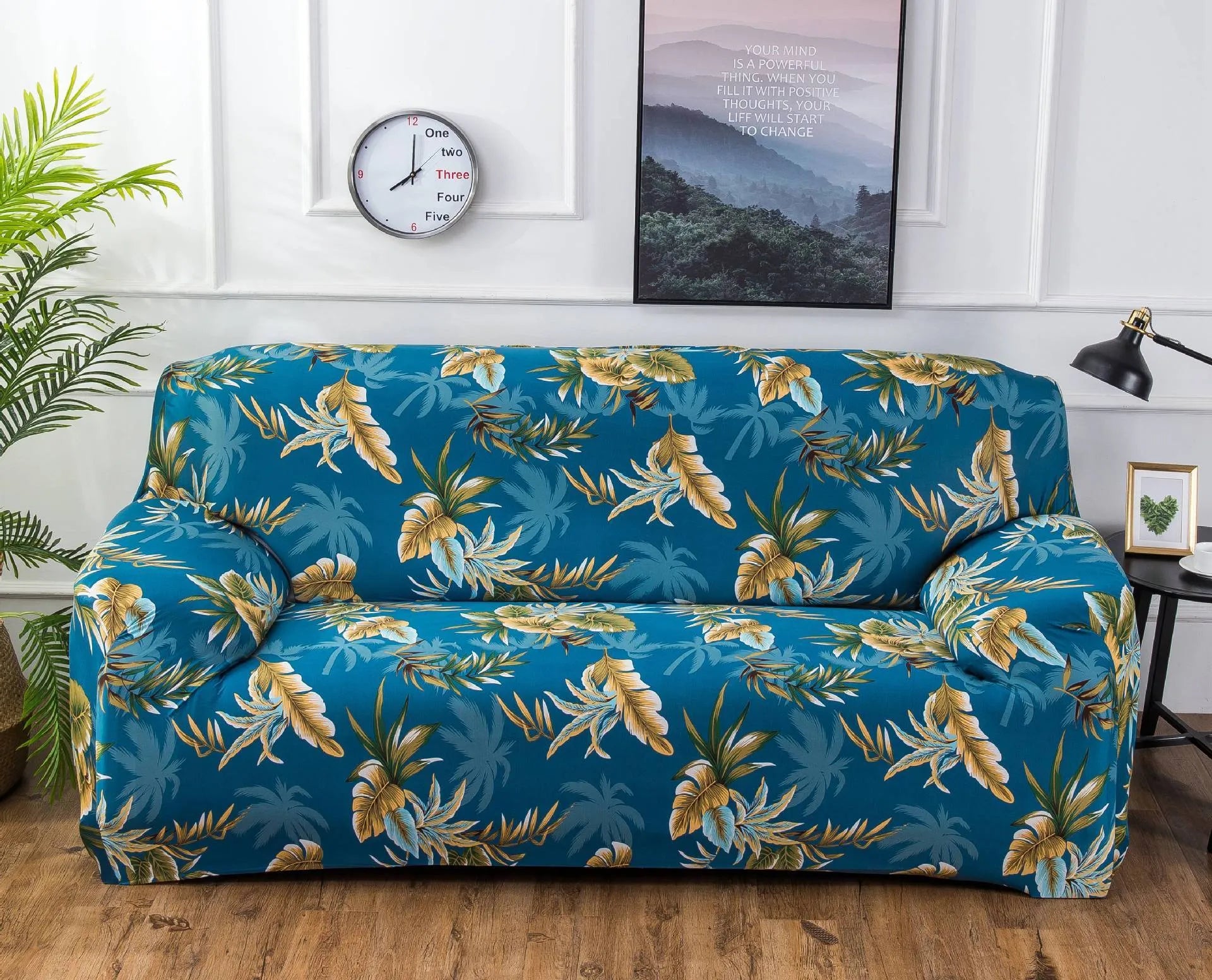 Geometric patterned stretch sofa slipcover fitted on a three-seater sofa