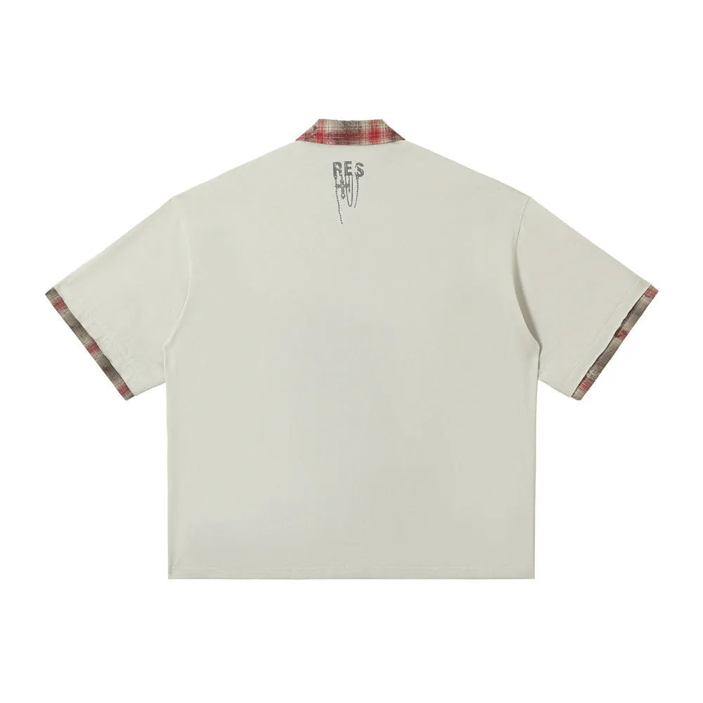 Men's loose blue cotton short-sleeved top with a graffiti print on the lapel.