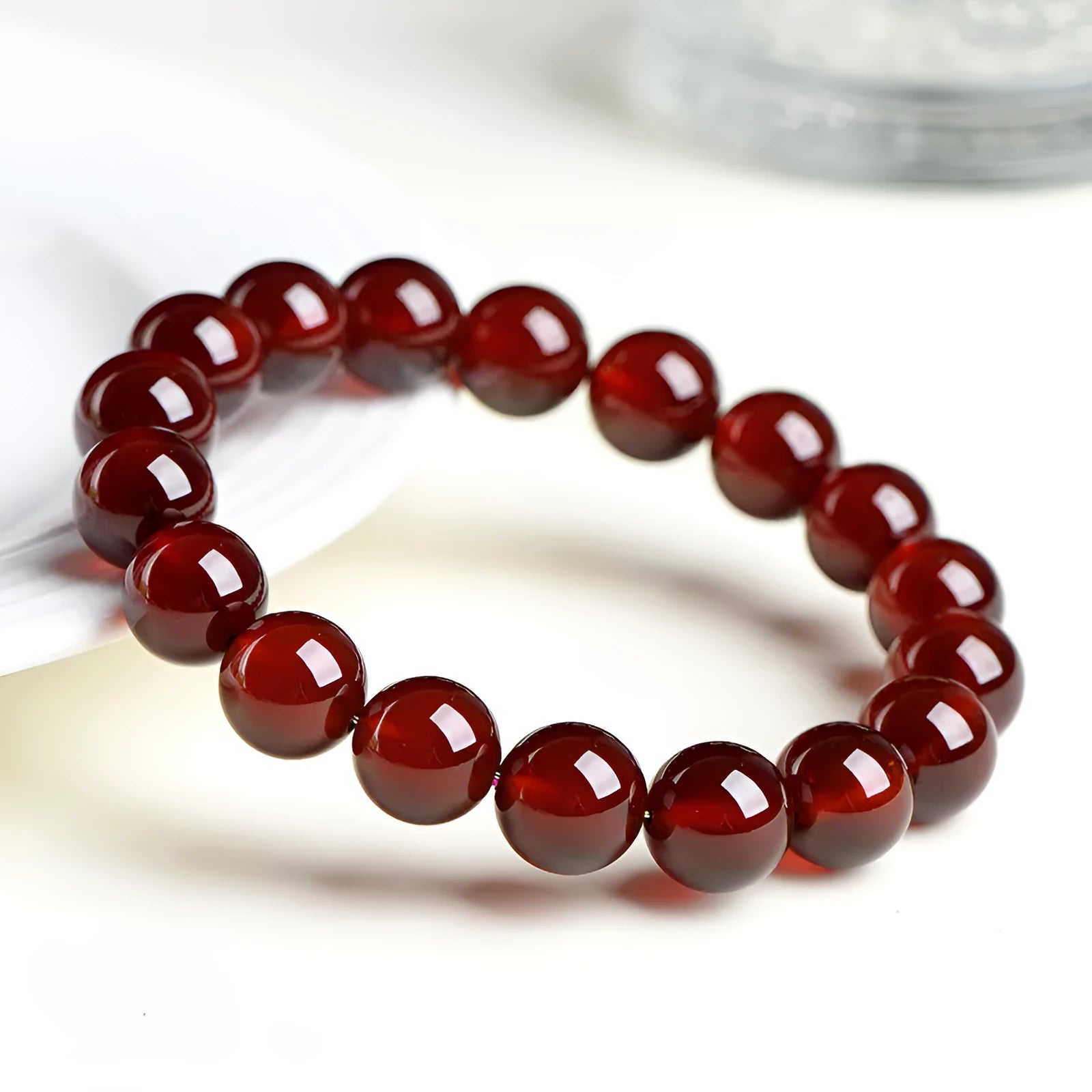 Natural orange red garnet crystal bracelet with traditional ruyi design elements in retro unisex style