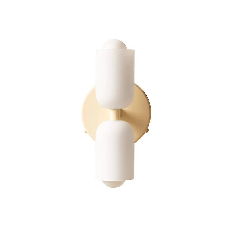 Cream base double head wall lamp with white glass shades against wall