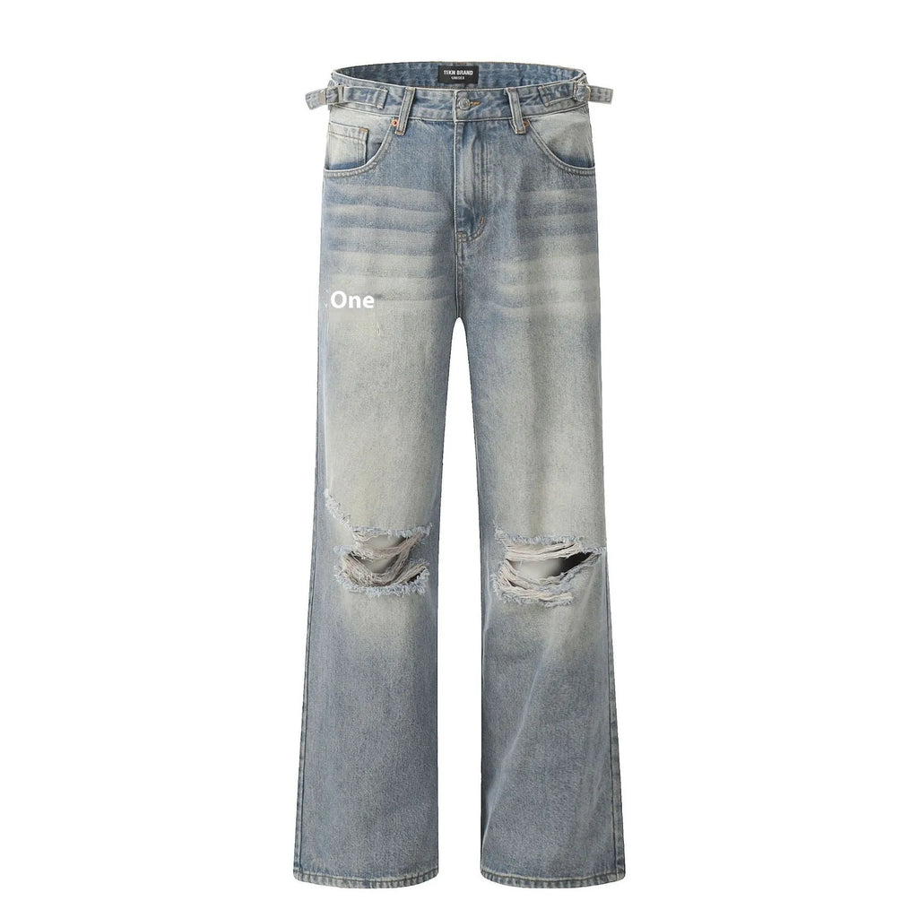 Man wearing blue ripped straight-leg jeans in a retro style with a zip fly.