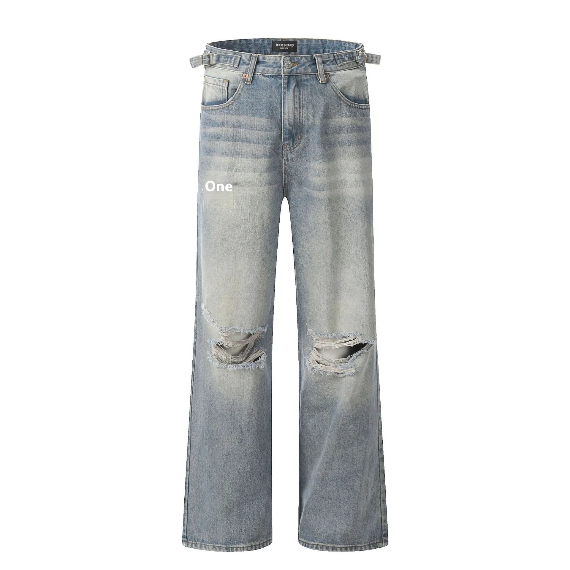 Man wearing blue ripped straight-leg jeans in a retro style with a zip fly.