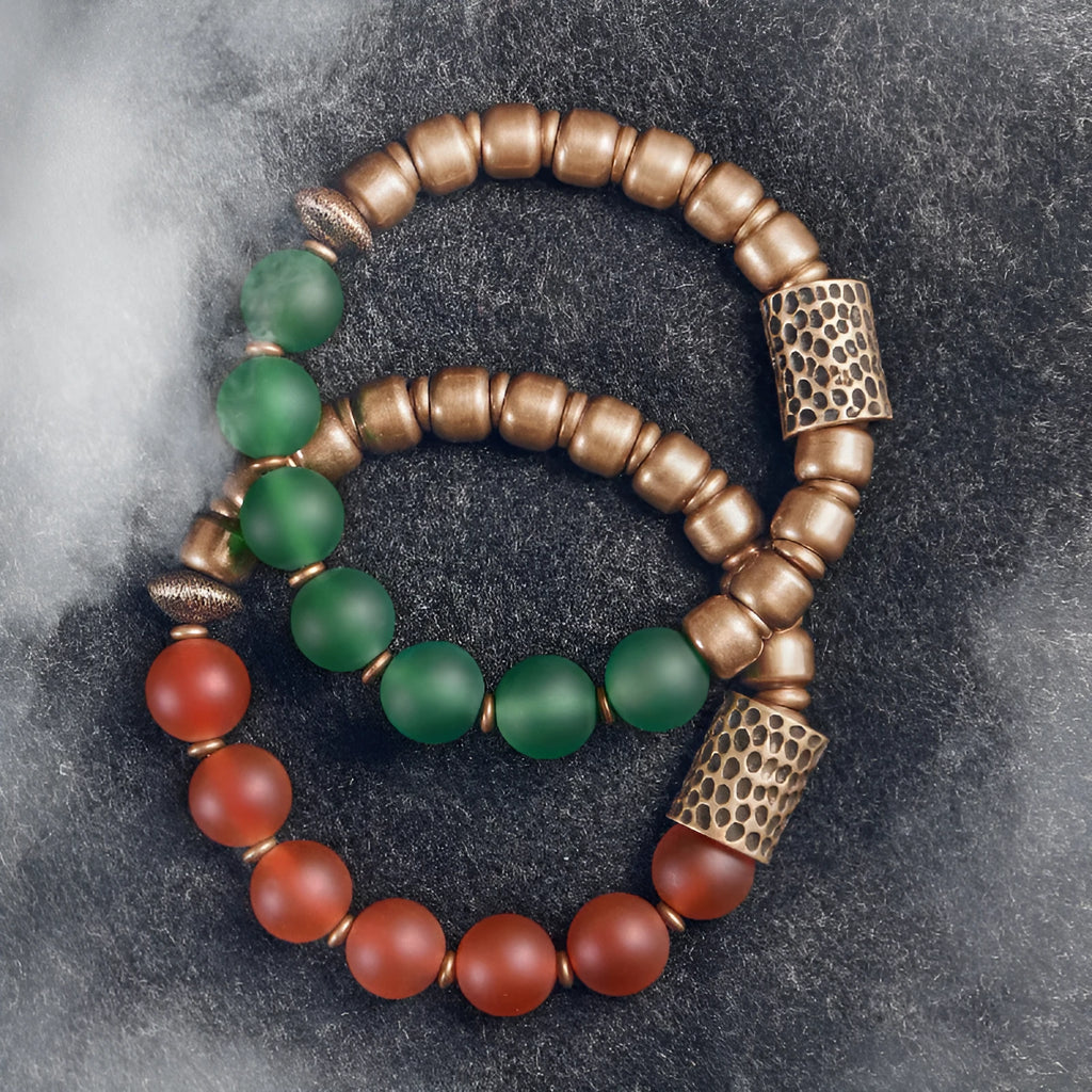 Retro ethnic style couples bracelet with green or red agate beads on a wrist.