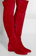 Grey suede women's flat over the knee boots with a pointed toe and thick low heel.