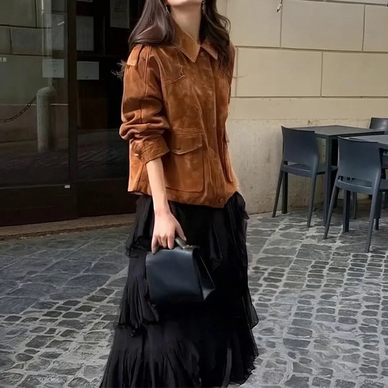 Women's brown suede-look polyester coat with regular sleeves on a hanger.
