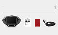 Black car head-up display unit on a dashboard with OBD cable and anti-slip pad.