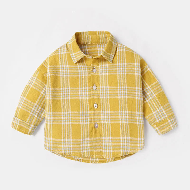 A boys' long sleeve cotton shirt with a lattice and cartoon pattern, shown in a light blue colour.