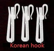 A simple blackout curtain panel hanging on a pole, demonstrating one of the hook, Korean hook, or ring attachment styles.