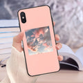 Pink hand-painted floral lattice design TPU case for iPhone on a table