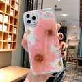 Floral iPhone case with large pink flower pattern on TPU back cover showing camera cutouts