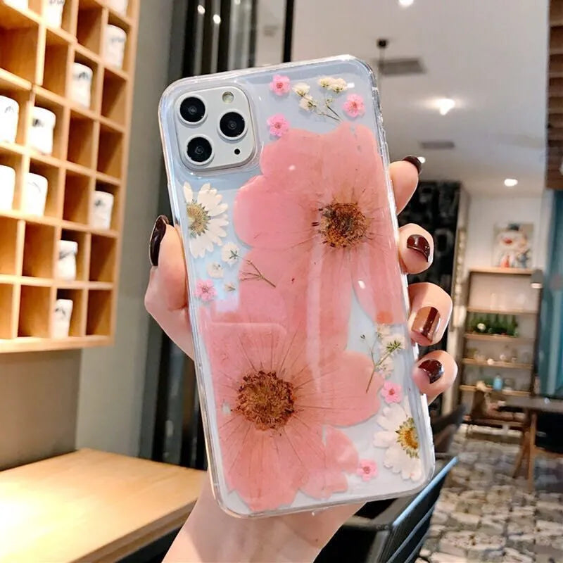Floral iPhone case with large pink flower pattern on TPU back cover showing camera cutouts