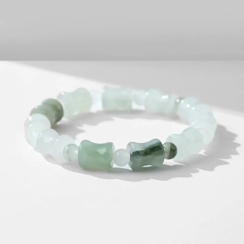 Natural chalcedony jade and coconut shell bead bracelet with diamond shapes and a safety lock clasp.