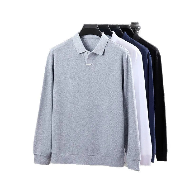 Man modelling a grey loose-fit cotton polo shirt with a lapel collar and asymmetric design.