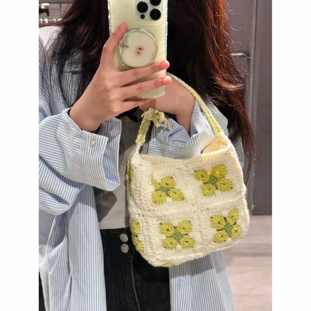 Handmade cotton crochet handbag with cherry blossom design and magnetic buckle closure