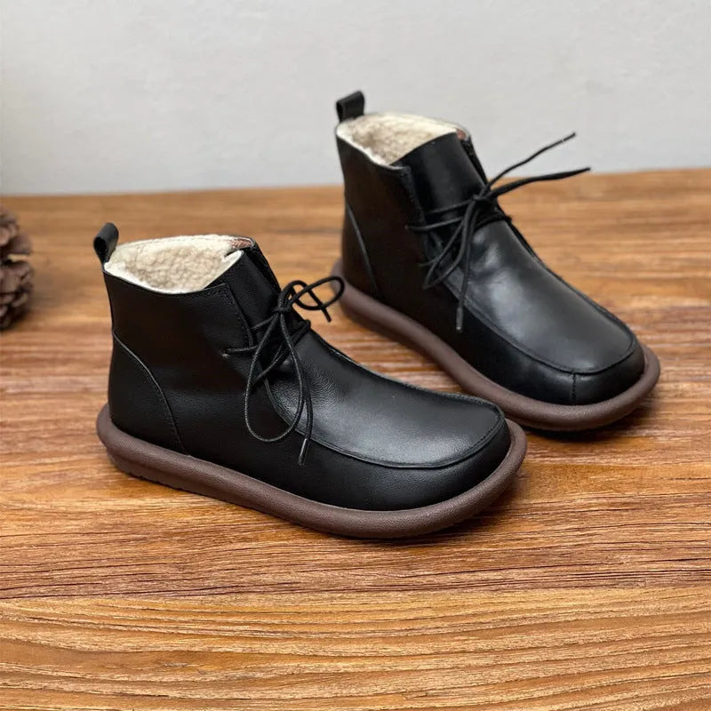 Women's black cowhide boots with flat heel and round toe, showing 9cm sock length