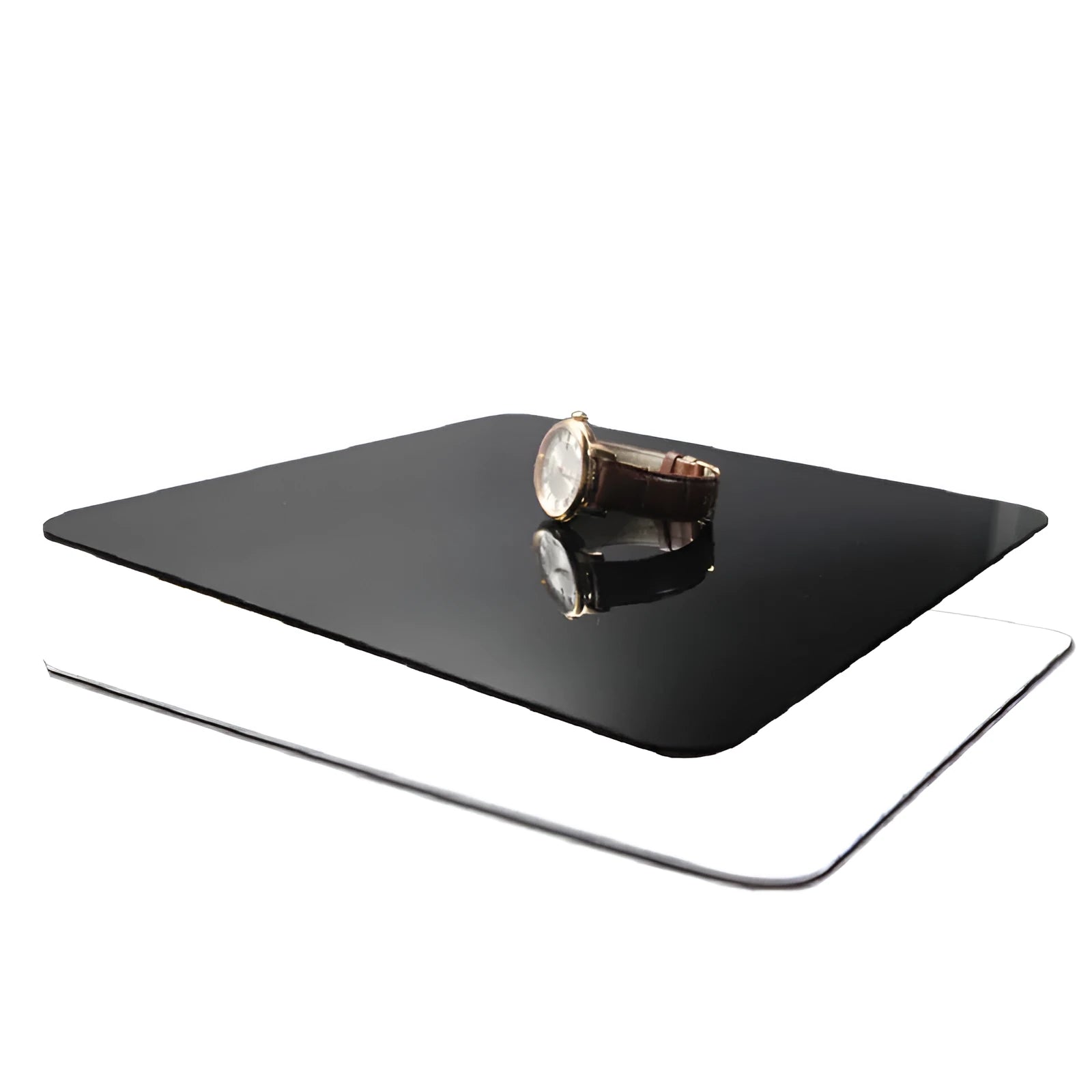 Square black and white acrylic shooting reflection boards for photography in three sizes on a table.