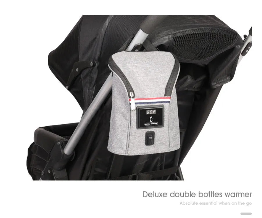 Grey Oxford cloth portable car USB baby bottle warmer with display, shown with two bottles and a 12V car charger.