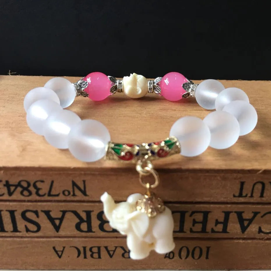 Crystal elephant charm bracelet with clear beads and gold finish metal charm