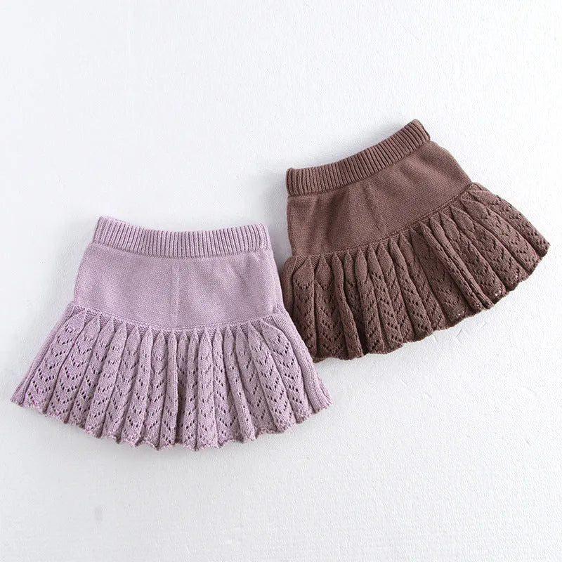 Girls hollow retro pleated pantskirt in light gray purple cotton, front view, on child of about 90cm height