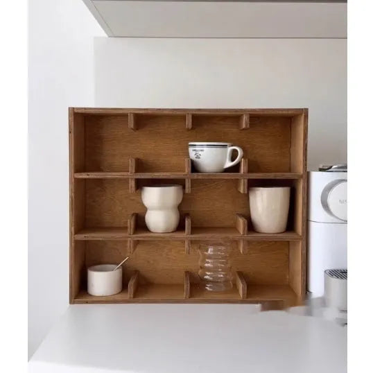 Solid birch wood cup storage rack with square compartments organising mugs on kitchen counter