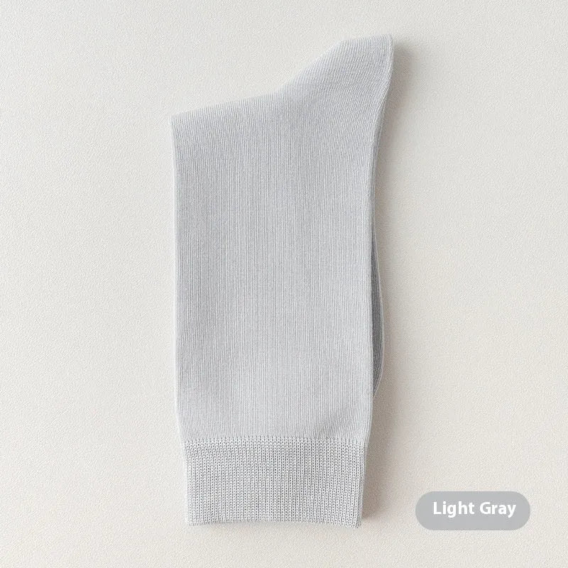 Mid-calf men's business socks in combed cotton available in twelve solid colours