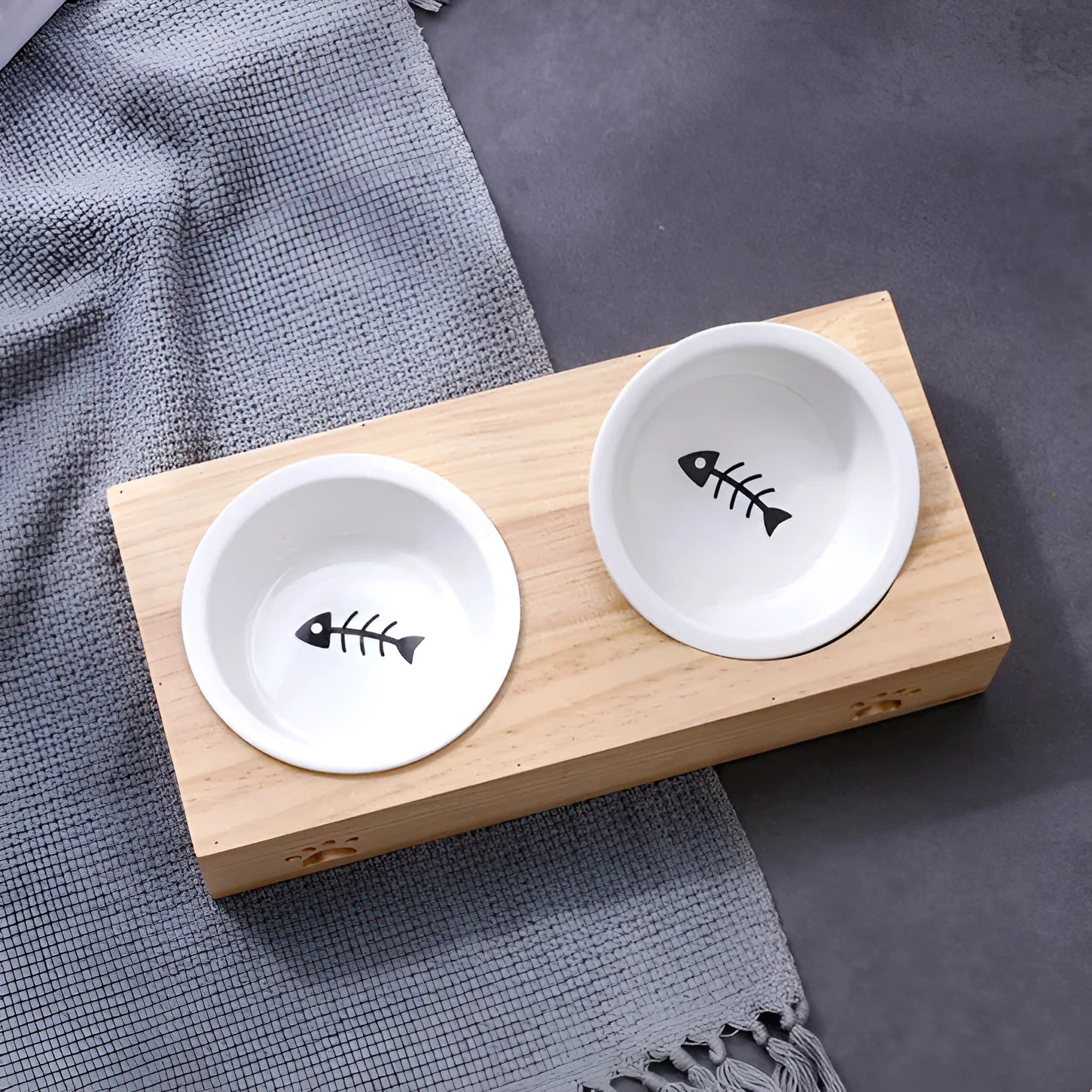 Solid wood pet dining table with stainless steel bowls in elevated feeding station design