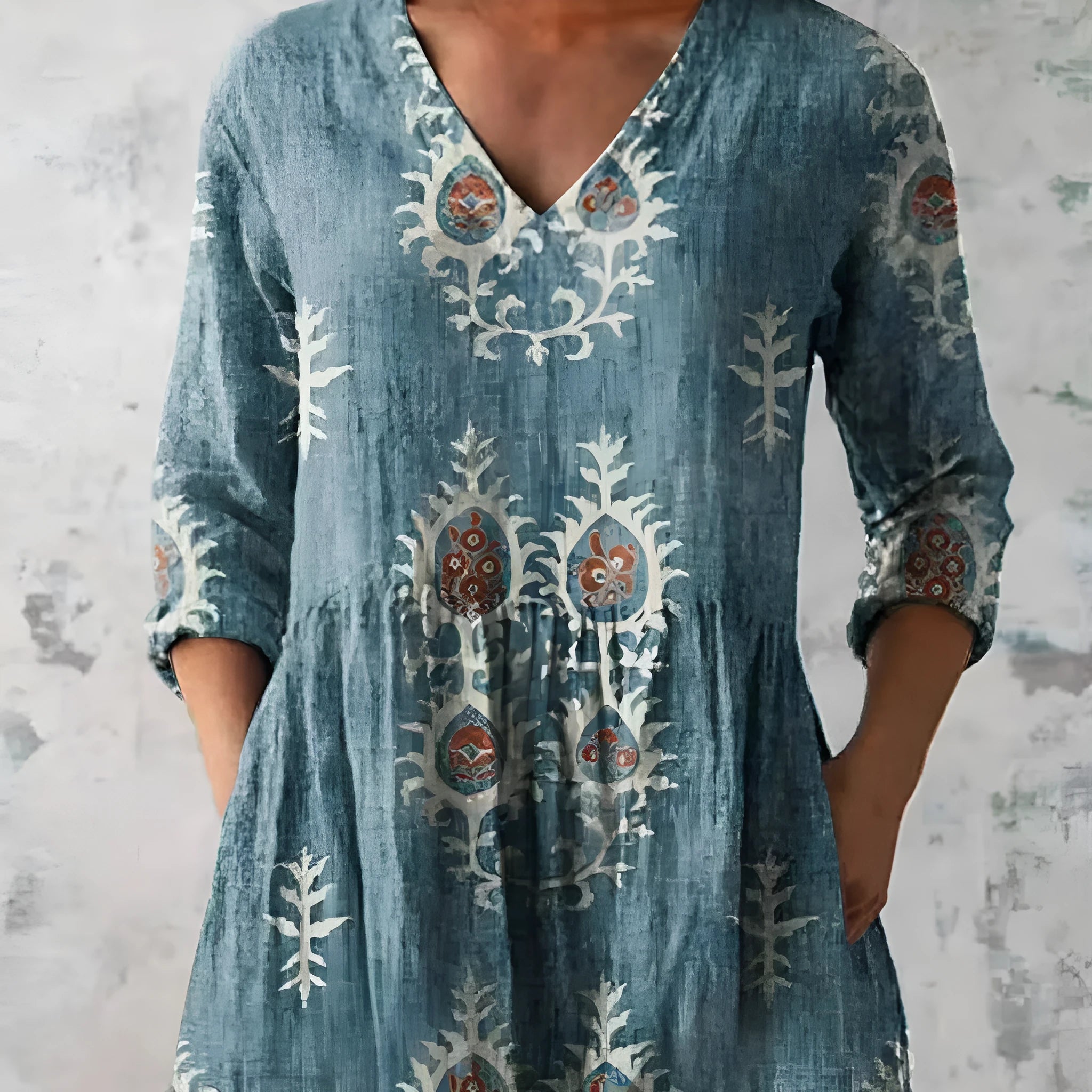 Women's loose fit printed dress with wide waist and three-quarter length sleeves.