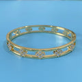Women's hollow bracelet with zircon stones and four-leaf clover design in gold or silver colour