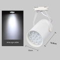 LED track spotlight with black aluminium shell mounted on lighting track
