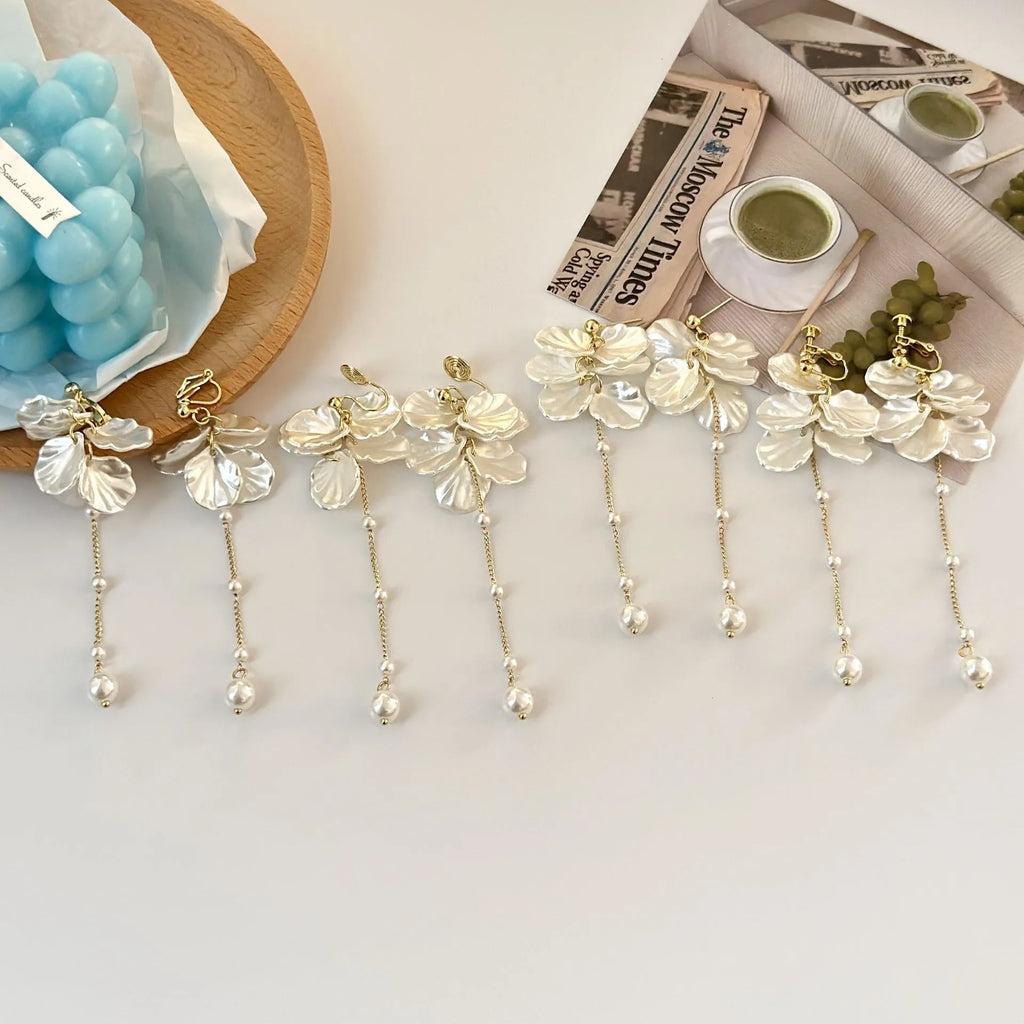 Women's acrylic shell pearl tassel earrings with 8.8cm drop length showing four different clip style options
