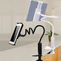 Flexible mount holder with bendy arm and suction base holding a smartphone