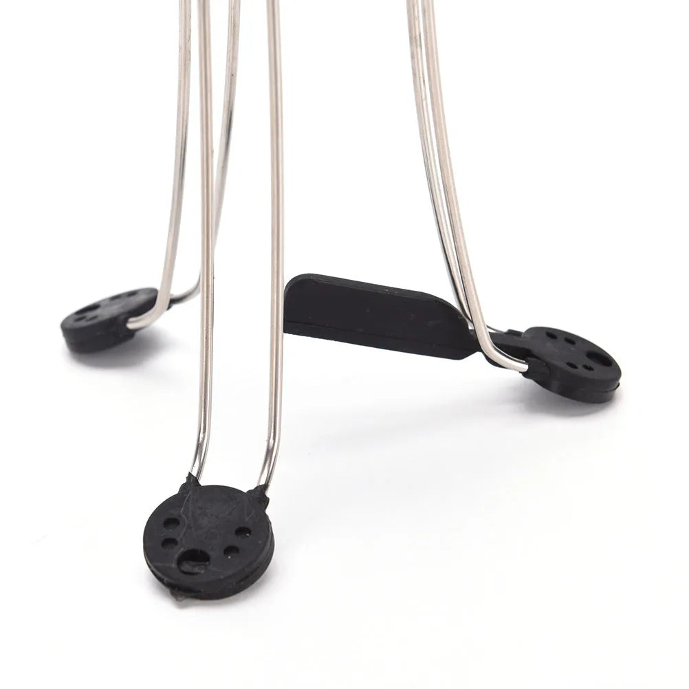 White and black automatic kitchen food stirrer with stainless steel whisk on countertop.